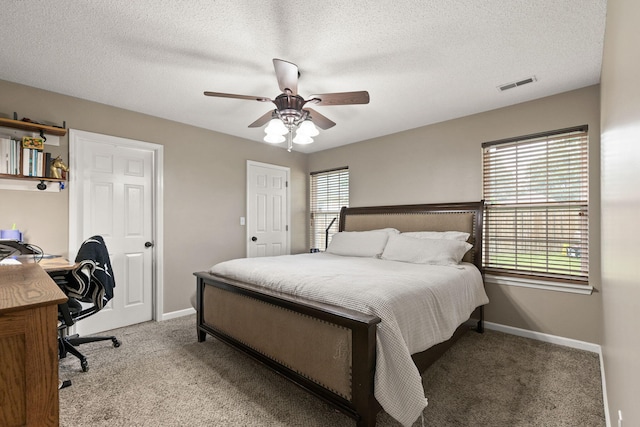 1807 E Phoenix Rd, Columbia, MO 65202 - bedroom featuring carpet, baseboards, a textured ceiling, a ceiling fan, and a desk