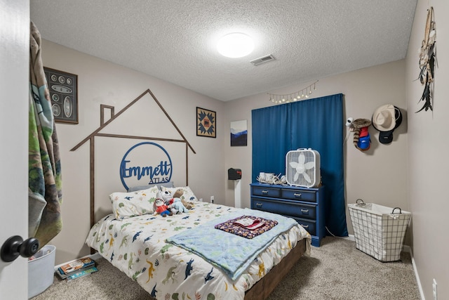 1807 E Phoenix Rd, Columbia, MO 65202 - bedroom with carpet and a textured ceiling