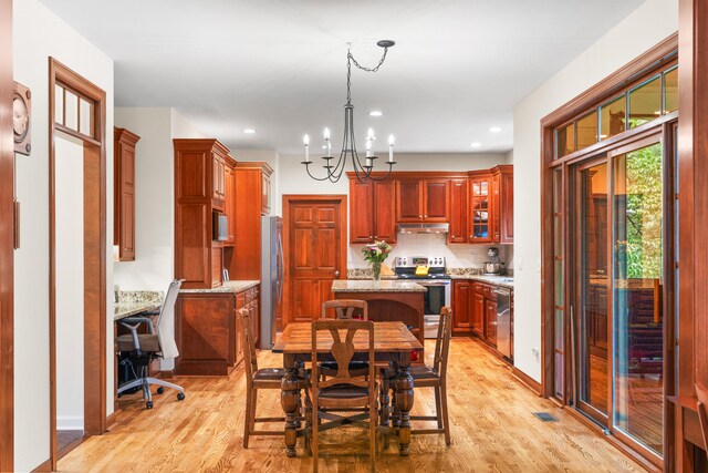 5208 E Tayside Cir, Columbia, MO 65203 - dining area featuring light wood-type flooring, a chandelier, a desk, recessed lighting, and baseboards
