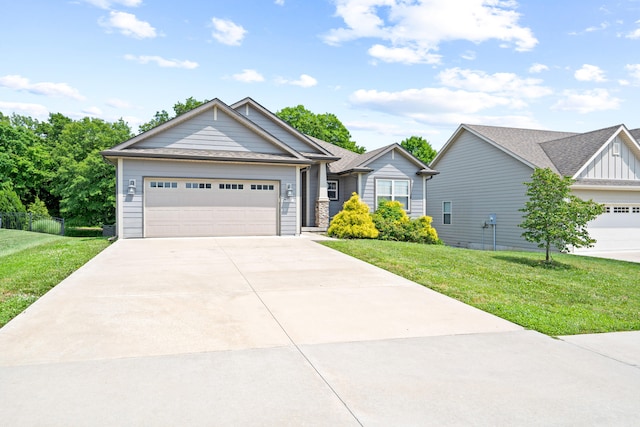 7400 Pemberton Dr, Columbia, MO 65203 - view of front of home with concrete driveway, a front yard, a garage, and roof with shingles