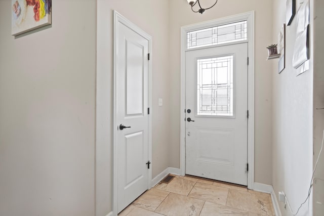 7400 Pemberton Dr, Columbia, MO 65203 - entryway featuring baseboards and light stone finish flooring