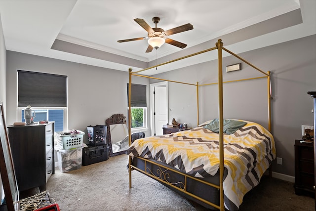 7400 Pemberton Dr, Columbia, MO 65203 - carpeted bedroom with ornamental molding, a tray ceiling, and a ceiling fan