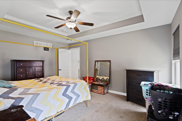 7400 Pemberton Dr, Columbia, MO 65203 - carpeted bedroom featuring a tray ceiling, ornamental molding, baseboards, and a ceiling fan