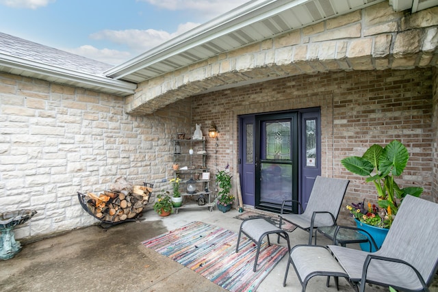 205 Jameson Dr, Ashland, MO 65010 - property entrance featuring stone siding and a patio