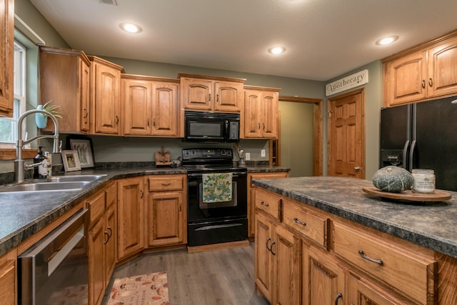 205 Jameson Dr, Ashland, MO 65010 - kitchen with black appliances, a sink, dark countertops, and recessed lighting