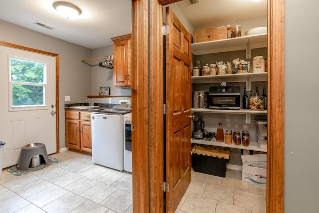 205 Jameson Dr, Ashland, MO 65010 - pantry featuring washing machine and clothes dryer and a sink