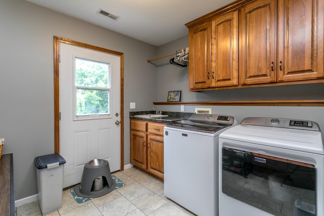 205 Jameson Dr, Ashland, MO 65010 - laundry room featuring cabinet space, washer and clothes dryer, baseboards, and light tile patterned flooring