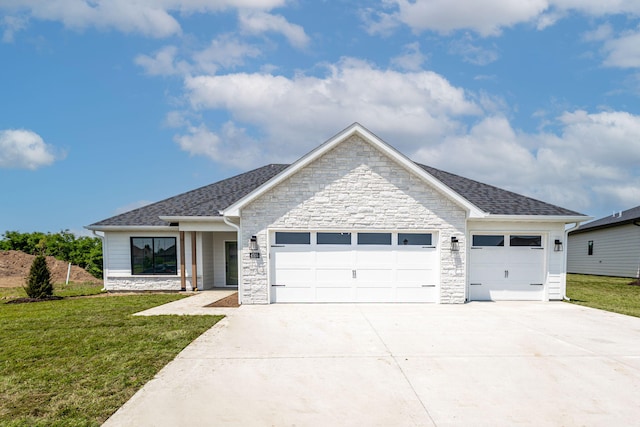 4505 Chambers Bay Dr, Columbia, MO 65201 - view of front of home with a garage, stone siding, and a front yard
