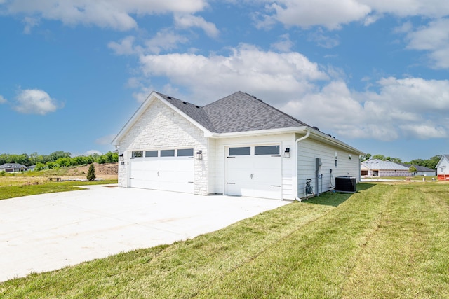 4505 Chambers Bay Dr, Columbia, MO 65201 - view of side of property featuring cooling unit, an attached garage, a yard, a shingled roof, and driveway
