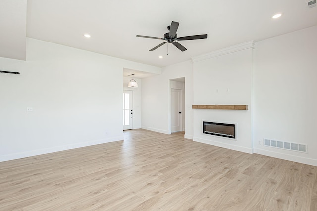 4505 Chambers Bay Dr, Columbia, MO 65201 - unfurnished living room featuring a ceiling fan, light wood-style floors, baseboards, a glass covered fireplace, and recessed lighting
