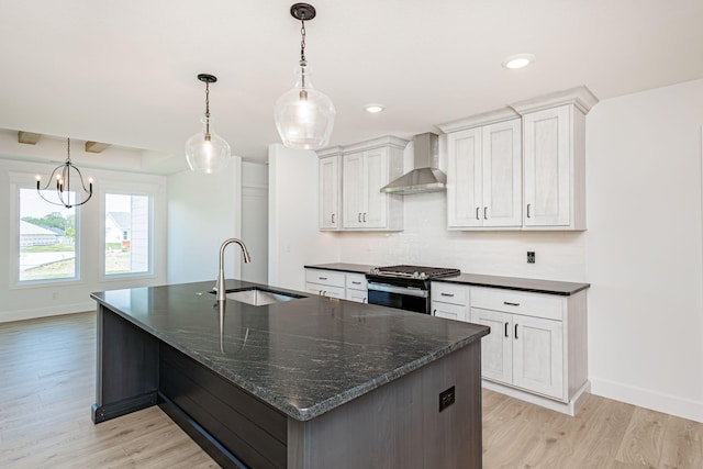 4505 Chambers Bay Dr, Columbia, MO 65201 - kitchen featuring wall chimney range hood, stove, a sink, baseboards, and recessed lighting