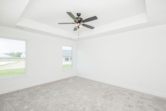 4505 Chambers Bay Dr, Columbia, MO 65201 - carpeted spare room featuring a raised ceiling, baseboards, and a ceiling fan