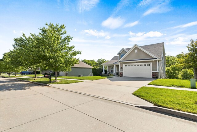 128 Cedar Falls Ct, Columbia, MO 65203 - view of front of house featuring a garage, a front yard, and concrete driveway