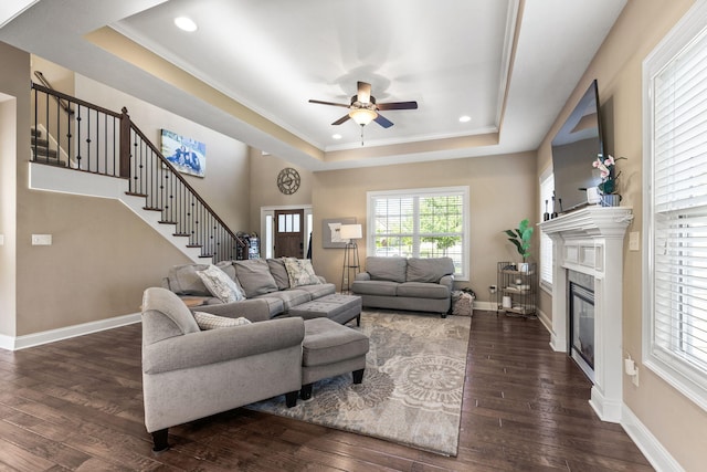 128 Cedar Falls Ct, Columbia, MO 65203 - living area with a tray ceiling, ceiling fan, stairs, dark wood-style flooring, and recessed lighting