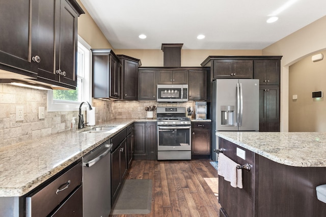 128 Cedar Falls Ct, Columbia, MO 65203 - kitchen featuring stainless steel appliances, a sink, dark brown cabinetry, dark wood-type flooring, and recessed lighting