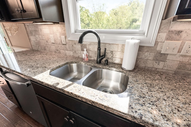 128 Cedar Falls Ct, Columbia, MO 65203 - kitchen view of a sink, tasteful backsplash, and light stone counters