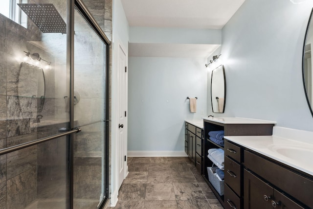 128 Cedar Falls Ct, Columbia, MO 65203 - full bathroom featuring a shower stall, two vanities, and baseboards