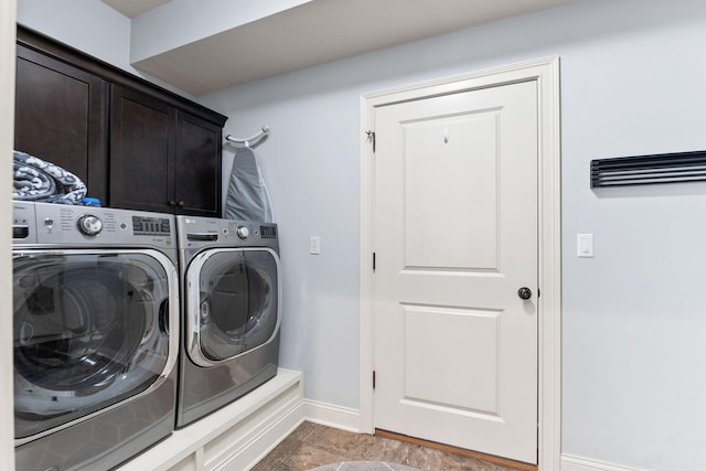 128 Cedar Falls Ct, Columbia, MO 65203 - washroom featuring cabinet space, separate washer and dryer, and baseboards