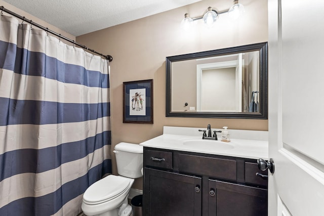 128 Cedar Falls Ct, Columbia, MO 65203 - bathroom with toilet, vanity, a textured ceiling, and a shower with curtain