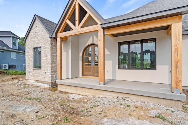 7200 Rudchester Ct, Columbia, MO 65203 - entrance to property featuring stone siding, stucco siding, and roof with shingles