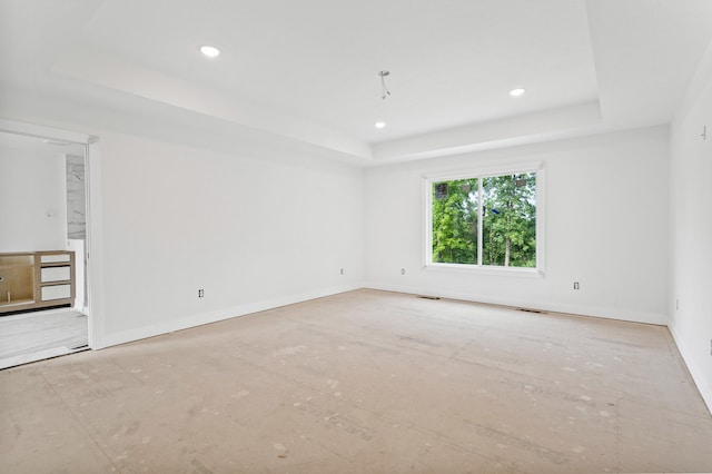 7200 Rudchester Ct, Columbia, MO 65203 - empty room featuring a tray ceiling, recessed lighting, and baseboards