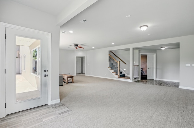 602 E Old Hawthorne Dr, Columbia, MO 65201 - unfurnished living room featuring stairway, light colored carpet, baseboards, and recessed lighting