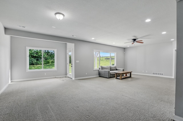 602 E Old Hawthorne Dr, Columbia, MO 65201 - living room with carpet, recessed lighting, a ceiling fan, and baseboards