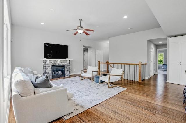 602 E Old Hawthorne Dr, Columbia, MO 65201 - living area featuring a ceiling fan, wood finished floors, recessed lighting, a fireplace, and baseboards