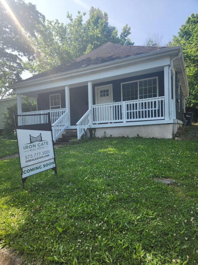 402 Duncan St, Columbia, MO 65203 - view of front of home with a porch and a front lawn