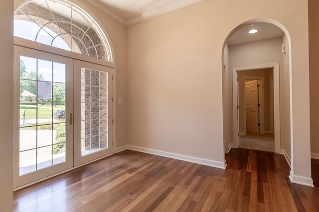 2409 Wild Oak Ct, Columbia, MO 65201 - foyer with arched walkways, wood finished floors, and ornamental molding