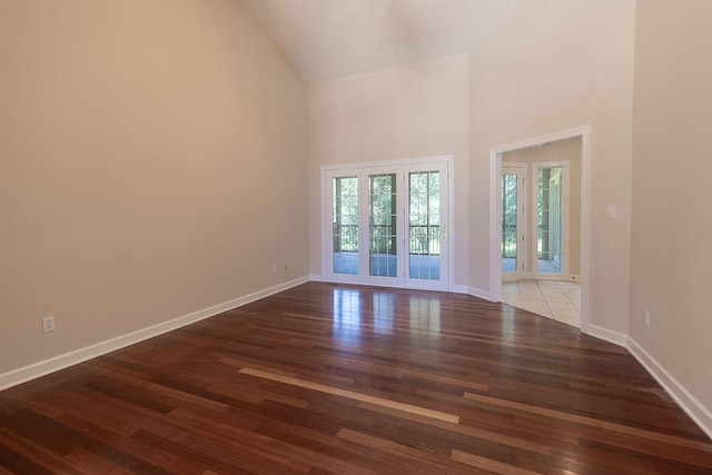 2409 Wild Oak Ct, Columbia, MO 65201 - spare room featuring high vaulted ceiling and wood finished floors