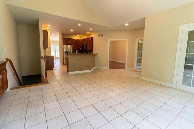 2409 Wild Oak Ct, Columbia, MO 65201 - kitchen with open floor plan, a peninsula, appliances with stainless steel finishes, lofted ceiling, and recessed lighting