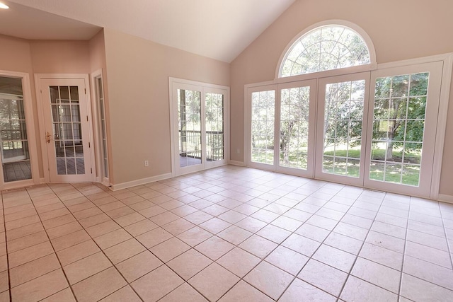 2409 Wild Oak Ct, Columbia, MO 65201 - spare room featuring light tile patterned flooring and high vaulted ceiling