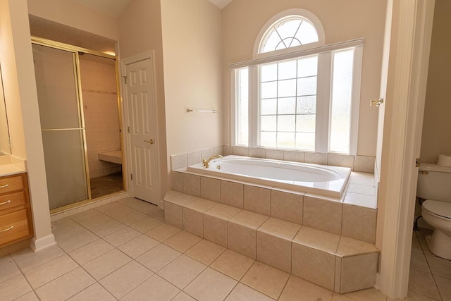 2409 Wild Oak Ct, Columbia, MO 65201 - bathroom with tile patterned floors, a garden tub, and plenty of natural light