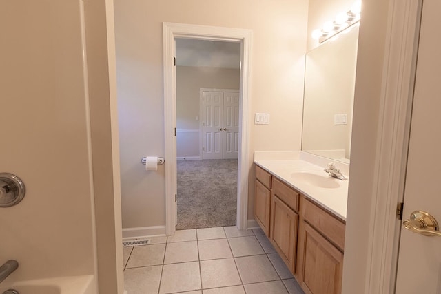 2409 Wild Oak Ct, Columbia, MO 65201 - bathroom with vanity, tile patterned flooring, and shower / bath combination