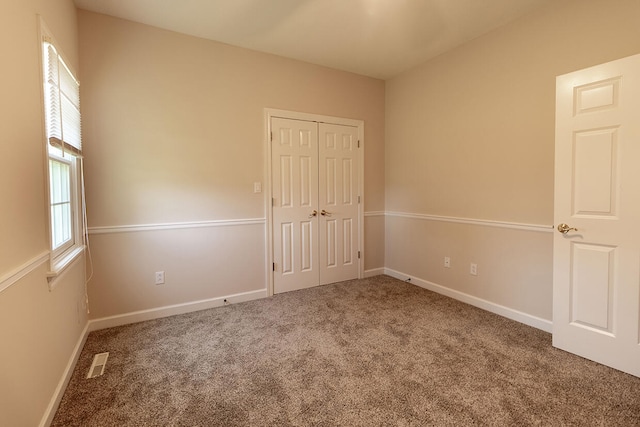 2409 Wild Oak Ct, Columbia, MO 65201 - unfurnished bedroom featuring carpet flooring and a closet