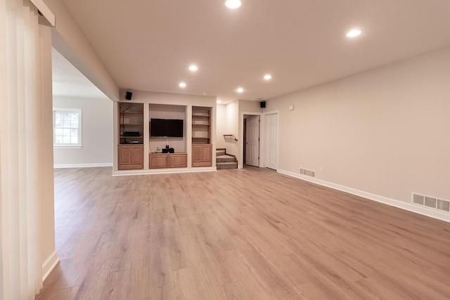 2409 Wild Oak Ct, Columbia, MO 65201 - unfurnished living room featuring stairway, light wood-type flooring, recessed lighting, and built in features