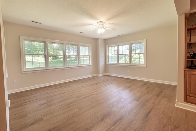 2409 Wild Oak Ct, Columbia, MO 65201 - unfurnished room with ceiling fan and light wood-type flooring