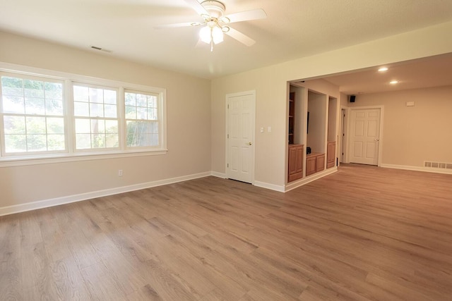 2409 Wild Oak Ct, Columbia, MO 65201 - empty room featuring light wood-style floors, a ceiling fan, and recessed lighting