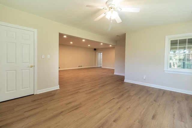 2409 Wild Oak Ct, Columbia, MO 65201 - unfurnished room featuring light wood-type flooring, a ceiling fan, and recessed lighting
