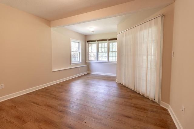2409 Wild Oak Ct, Columbia, MO 65201 - spare room with wood finished floors and baseboards