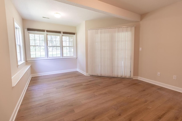 2409 Wild Oak Ct, Columbia, MO 65201 - spare room featuring wood finished floors and baseboards