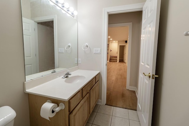 2409 Wild Oak Ct, Columbia, MO 65201 - half bathroom featuring vanity and tile patterned flooring
