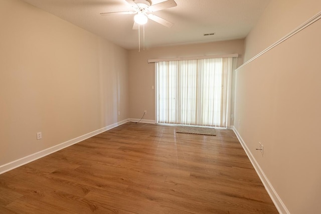 2409 Wild Oak Ct, Columbia, MO 65201 - unfurnished room featuring a ceiling fan and wood finished floors