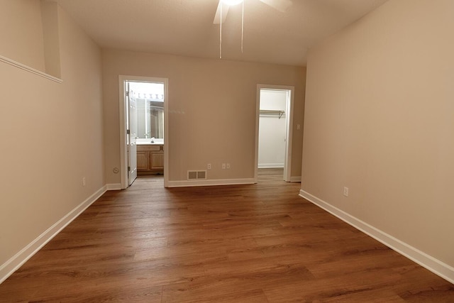 2409 Wild Oak Ct, Columbia, MO 65201 - empty room with dark wood-style floors and a ceiling fan
