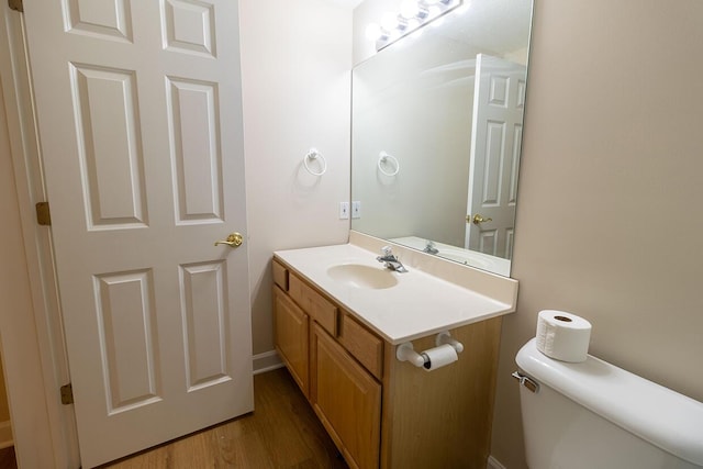2409 Wild Oak Ct, Columbia, MO 65201 - half bath with vanity and wood finished floors