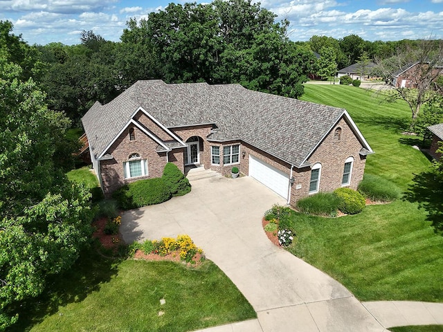 2409 Wild Oak Ct, Columbia, MO 65201 - view of front of property featuring a garage, brick siding, concrete driveway, and a front lawn