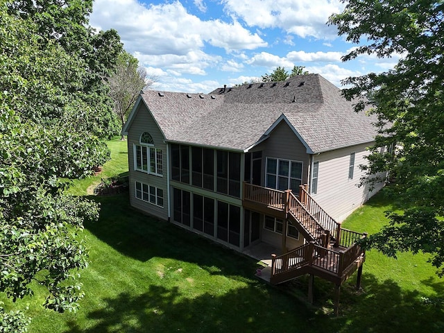 2409 Wild Oak Ct, Columbia, MO 65201 - rear view of property featuring a sunroom, roof with shingles, and a yard
