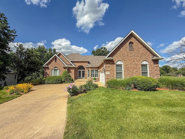 2409 Wild Oak Ct, Columbia, MO 65201 - view of front of property featuring brick siding, a front lawn, and roof with shingles