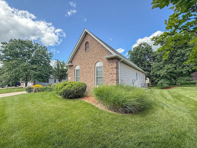 2409 Wild Oak Ct, Columbia, MO 65201 - view of property exterior with brick siding and a yard